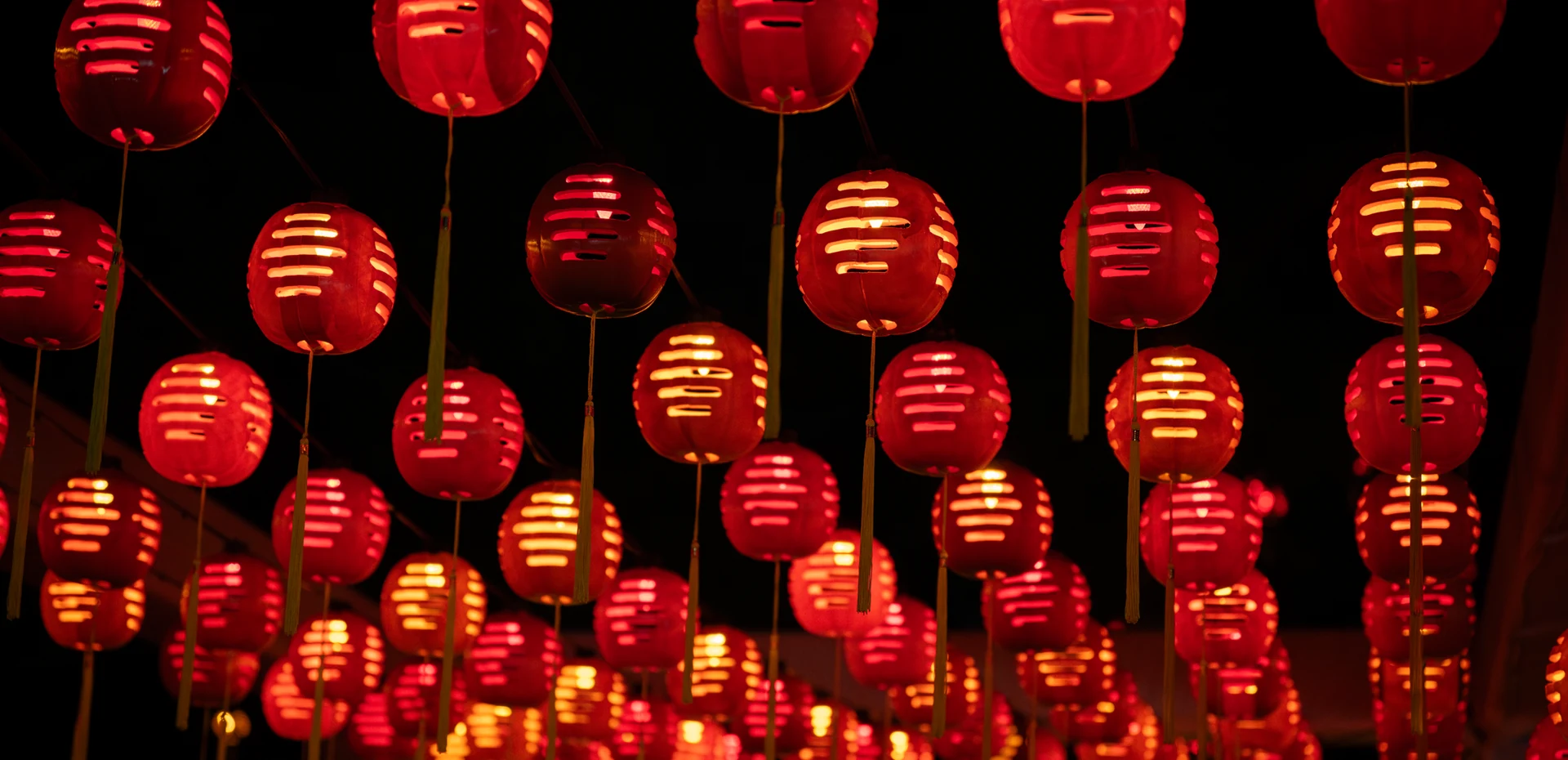 A canopy of glowing red lanterns over the Forbidden City trail